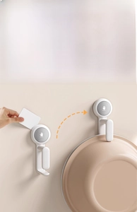 Close-up of vacuum suction cup hook showing removal process and strong load-bearing capacity