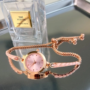 Elegant rose gold quartz watch with pink dial and adjustable mesh chain bracelet