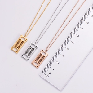 Macro view of three creative abacus pendant necklaces in gold, silver, and rose gold