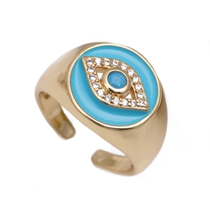 Adjustable gold evil eye ring with blue enamel and sparkling white zircon accents