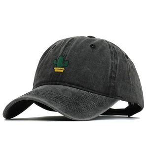 Detail of washed cotton dark grey baseball cap with embroidered green cactus plant