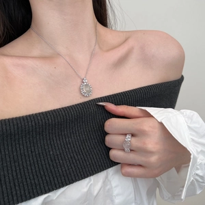 Detailed view of elegant S925 silver jewelry set featuring oval stones on a model