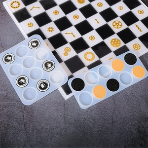 Translucent silicone mold for chess pieces with crown resin inserts and golden gears
