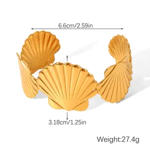 Detailed view of golden shell cuff bracelet with dimensions 6.6cm inner diameter and 27.4g weight
