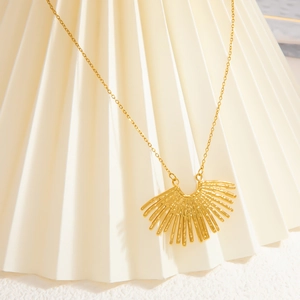 Detail of 18k gold plated stainless steel necklace with radial fan-shaped pendant