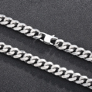 Close-up of polished silver titanium steel curb chain with a secure lobster clasp
