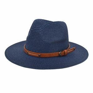 Detail of navy blue straw fedora featuring a brown leather band with metal buckle