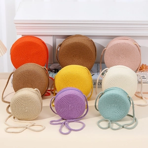 Handmade mini round straw woven crossbody bags in vibrant colors for beach summer style