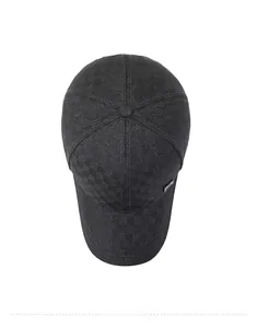 Detailed top view of dark grey baseball cap showing checkered fabric and metal logo