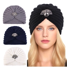 Detail of knitted beanie with scallop rhinestone accents in black, grey, navy, and white