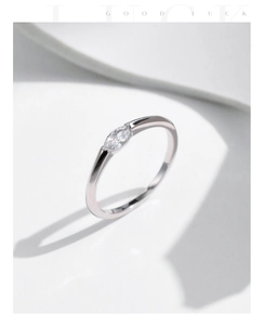 Macro shot of a minimalist s925 silver ring featuring a sparkling marquise-cut center stone