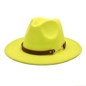 Detail of neon yellow wool fedora hat with brown leather band and gold horsebit buckle