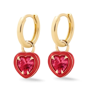 Detailed close-up of pink heart-shaped crystal earrings with red enamel edges and gold hoop