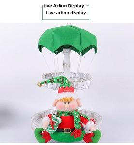 Detailed view of Christmas elf doll hanging on a parachute with red and green fabric textures