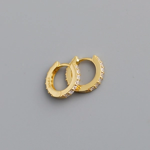 Macro detail of gold plated S925 sterling silver hoop earrings with pavé colored zircons