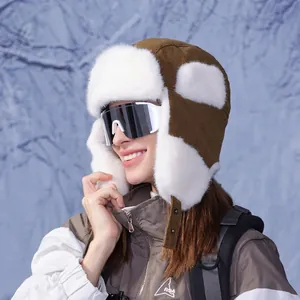 Brown corduroy winter aviator hat with faux fur lining and ear flaps for skiing