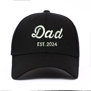 Distressed black washed cotton baseball cap with Dad EST. 2024 white embroidery