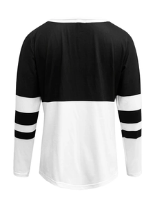 Back view of long-sleeve sweatshirt with black and white color block and striped sleeves