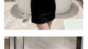 Detailed view of the tailored black slim fit mini dress waistline and knit fabric texture