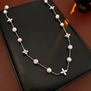 Exquisite gold-plated flower necklace with pearls and zircon stones on black leather