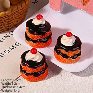 Macro view of miniature chocolate cake charms on a tray with dimension measurements