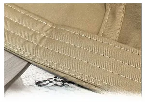 Détail d'un bandeau anti-transpiration kaki renforcé avec triple couture sur casquette