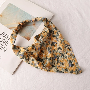 Detail of floral chiffon triangle kerchief with yellow print and elastic band