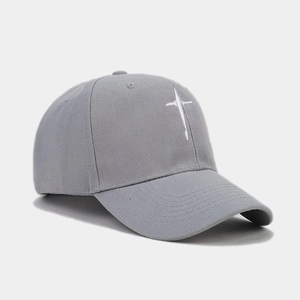 Detailed close-up of white star embroidery on a grey cotton twill baseball cap