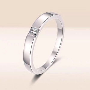 Minimalist S925 sterling silver ring with princess cut moissanite on beige background