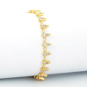 Chunky gold-plated star geometric bracelet with pavé cubic zirconia on white background
