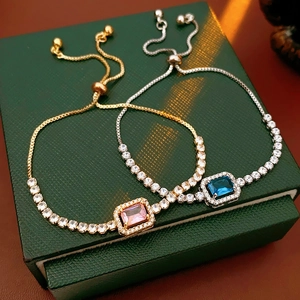 Macro detail of adjustable slider tennis bracelets with pink and blue rectangular zircons