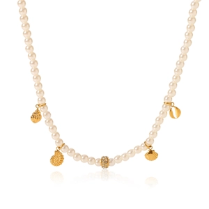 Detailed view of pearl necklace featuring gold shell pendant and sparkling crystal bead