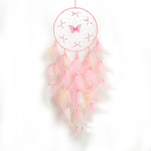 Pink and white dreamcatcher with delicate feathers and butterfly decor for wall hanging