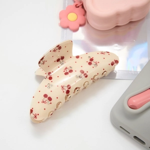 Elegant beige acetate hair claw clip with red cherry patterns and crystal accents
