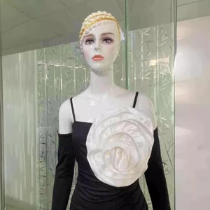 Off-shoulder black dress with white floral applique and matching sleeve shawl