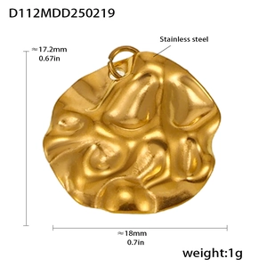 Detail of 18k gold plated irregular wave pendant in stainless steel with 18mm diameter