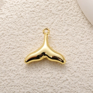 Golden whale tail pendant for DIY jewelry making with polished metallic finish