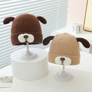 Winter knitted baby hats with cute puppy ears and thick warm lining in brown and beige