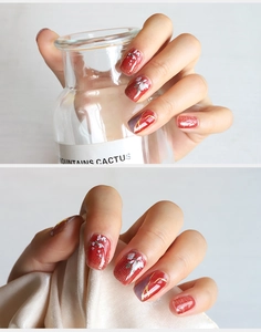 Detailed 5D red nail stickers with floral patterns, gold foil accents, and clouds