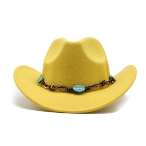 Close-up of yellow wool cowboy hat with turquoise gemstone woven band decoration