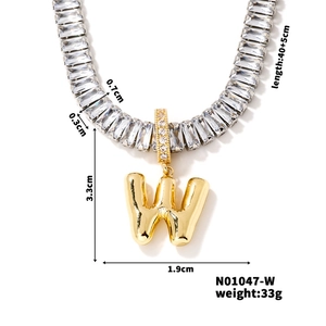 Detail view of golden W pendant size 3.3x1.9cm with iced out chain and dimensions