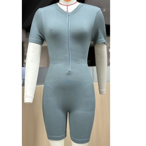 Detail of blue rib-knit seamless bodysuit with front zipper and short sleeves for sports