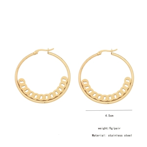 Detailed view of large gold stainless steel hoop earrings with 4.5cm diameter on white background