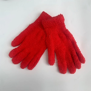 Close-up of soft red coral fleece knit gloves for winter warmth and comfort