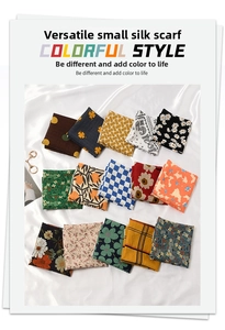 Gros plan de foulards pliés en coton-lin avec motifs floraux, à pois et paisley