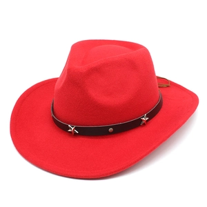 Detail of red wool felt cowboy hat with black band and silver star rivets decoration