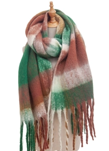 Detail of a thick green and brown plaid loop yarn scarf with fringe on a wooden mannequin