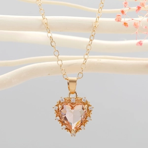 Elegant gold heart pendant necklace with champagne crystal and zircon accents on O-chain