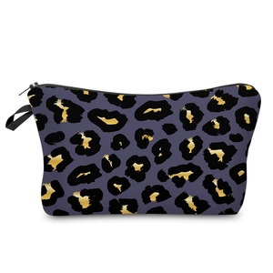 Detail of 3D leopard print makeup bag with purple base, golden spots, and black zipper