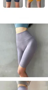 Macro view of seamless high-waist yoga shorts in purple featuring vertical ribbed texture